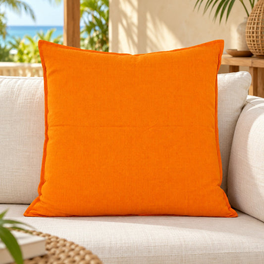 Orange Pop cushion cover in a tropical coastal setting